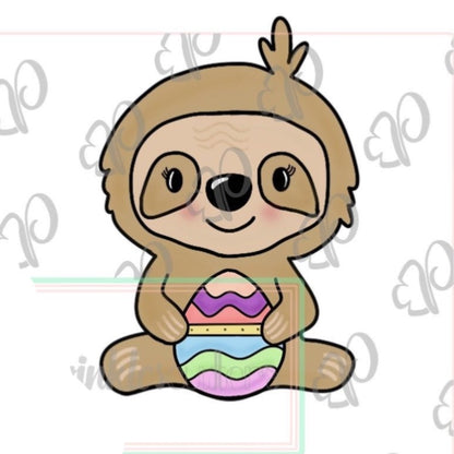 Whimsy Sloth holding an Egg Cookie Cutter - Periwinkles Cutters